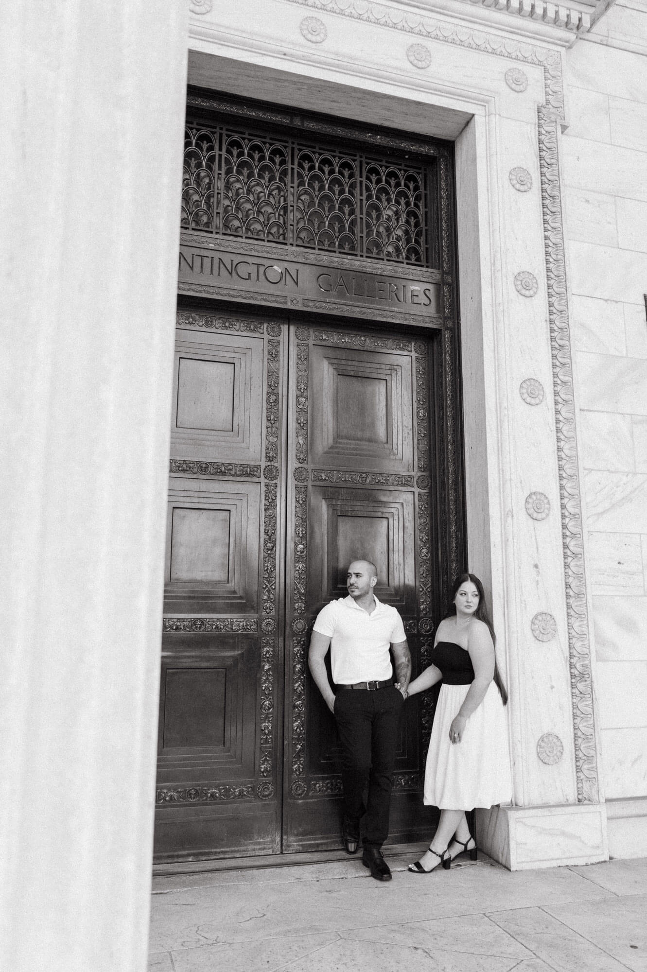 Couple framed by the Huntington Galleries doorway.